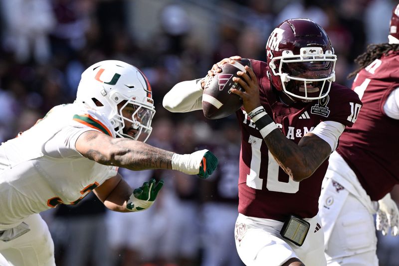 Dec 20, 2025; College Station, TX, USA; Texas A&M Aggies quarterback Marcel Reed (10) scrambles against Miami Hurricanes defensive lineman Akheem Mesidor (3) during the second half of the first round game of the CFP National Playoff at Kyle Field. Mandatory Credit: Jerome Miron-Imagn Images