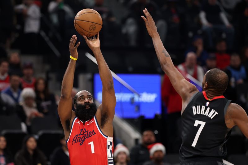 Dec 23, 2025; Inglewood, California, USA; Los Angeles Clippers guard James Harden (1) shoots the ball over Houston Rockets forward Kevin Durant (7) during the first quarter at Intuit Dome. Mandatory Credit: Kiyoshi Mio-Imagn Images