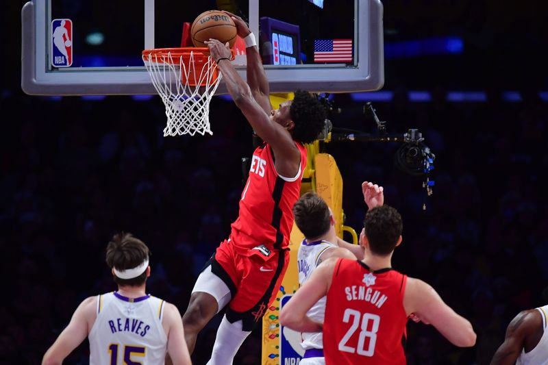 Dec 25, 2025; Los Angeles, California, USA; Houston Rockets guard Amen Thompson (1) dunks for the basket against the Los Angeles Lakers during the first half at Crypto.com Arena. Mandatory Credit: Gary A. Vasquez-Imagn Images