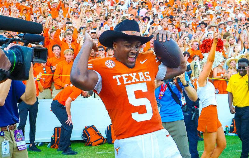 Oct 11, 2025; Dallas, Texas, USA; Texas Longhorns running back Quintrevion Wisner (5) celebrates after the game against the Oklahoma Sooners at the Cotton Bowl. Mandatory Credit: Kevin Jairaj-Imagn Images