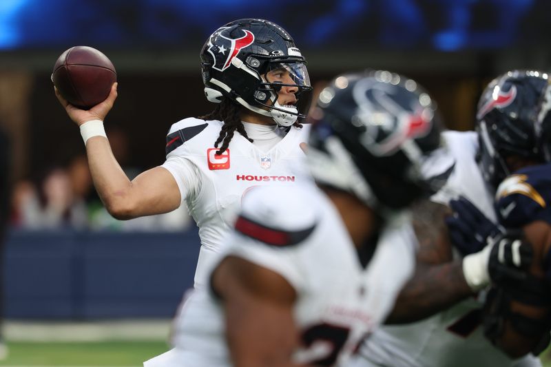 Dec 27, 2025; Inglewood, California, USA; Houston Texans quarterback C.J. Stroud (7) throws the ball downfield against the Los Angeles Chargers during the first half at SoFi Stadium. Mandatory Credit: Kiyoshi Mio-Imagn Images