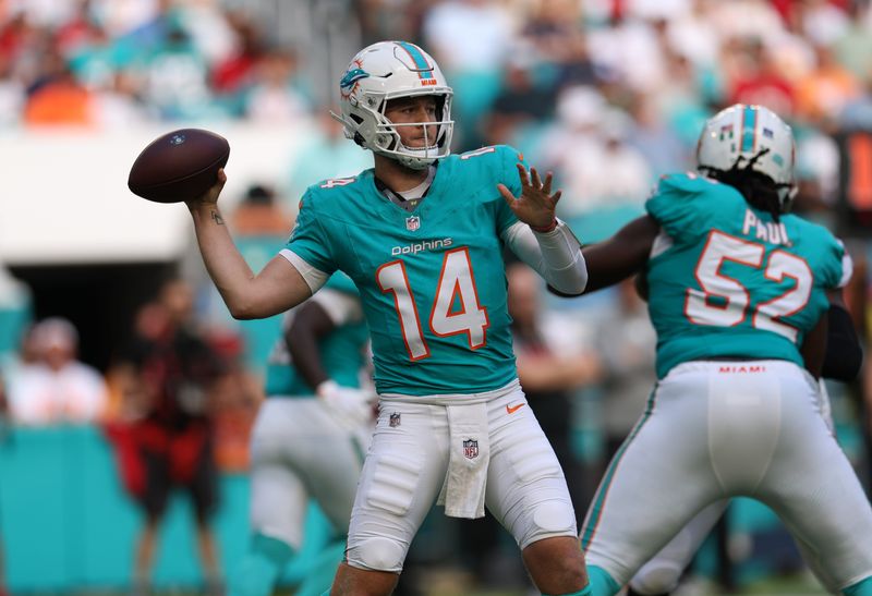 Dec 28, 2025; Miami Gardens, Florida, USA; Miami Dolphins quarterback Quinn Ewers (14) throws downfield during the third quarter against the Tampa Bay Buccaneers at Hard Rock Stadium. Mandatory Credit: Nathan Ray Seebeck-Imagn Images