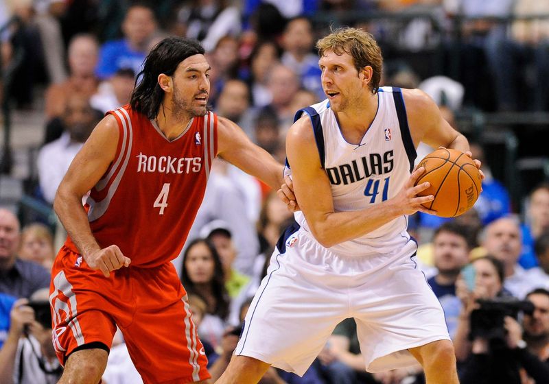Apr 18, 2012; Dallas, TX, USA; Houston Rockets power forward Luis Scola (4) guards Dallas Mavericks power forward Dirk Nowitzki (41) during the game at the American Airlines Center. The Mavericks defeated the Rockets 117-110. Mandatory Credit: Jerome Miron-USA TODAY Sports
