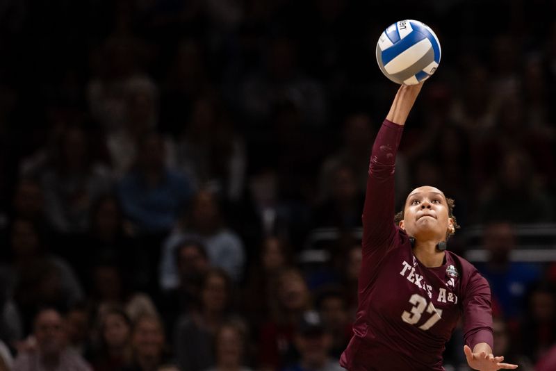 Dec 18, 2025; Kansas City, MO, USA; Texas A&M Aggies outside hitter Kyndal Stowers (37) serves in a 2025 NCAA Women’s Volleyball Championship semifinal match at T-Mobile Center. Mandatory Credit: Kylie Graham-Imagn Images