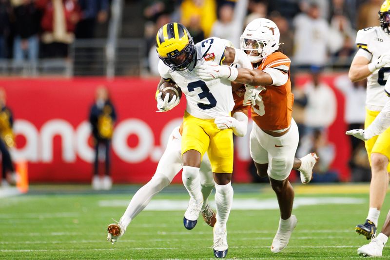 Dec 31, 2025; Orlando, FL, USA; Texas Longhorns defensive back Jonah Williams (9) tackles Michigan Wolverines wide receiver Fredrick Moore (3) during the second half at Camping World Stadium. Mandatory Credit: Matt Pendleton-Imagn Images