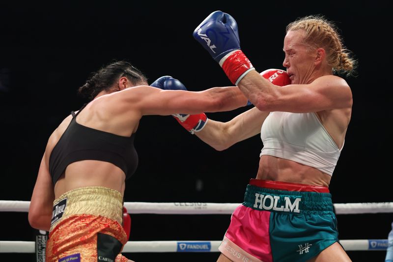 El Paso's Stephanie Han punches Holly Holm during their WBA lightweight title fight at the Coliseo Roberto Clemente in San Juan, Puerto Rico on Jan. 3, 2026.