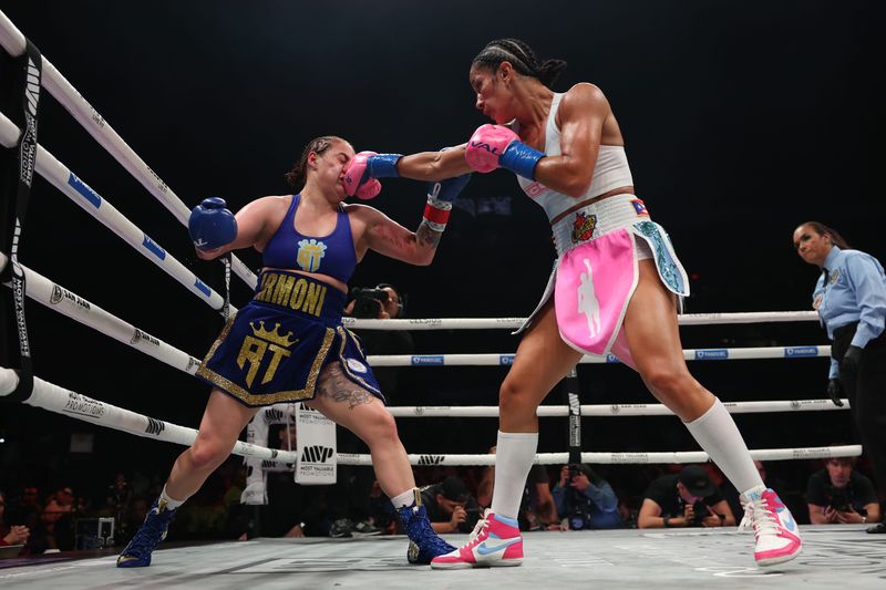 SAN JUAN, PUERTO RICO - JANUARY 03: (R-L) Amanda Serrano punches Reina Tellez for the unified World Featherweight Championship at Coliseo Roberto Clemente on January 03, 2026 in San Juan, Puerto Rico.