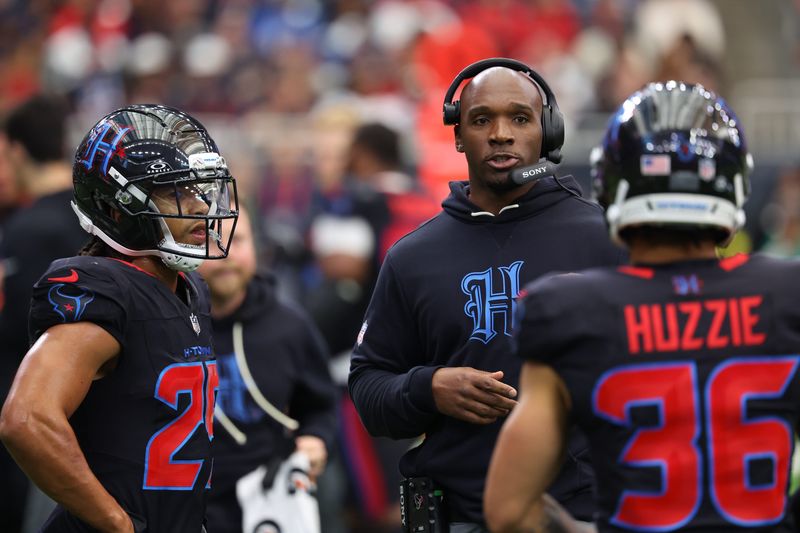 Jan 4, 2026; Houston, Texas, USA; Houston Texans head coach Demeco Ryans with cornerback Myles Bryant (25) on the sidelines during the second half against the Indianapolis Colts at NRG Stadium. Mandatory Credit: Thomas Shea-Imagn Images