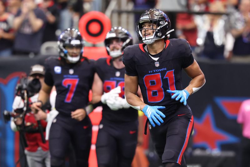 Jan 4, 2026; Houston, Texas, USA; Houston Texans wide receiver Jayden Higgins (81) runs off the field after making a touchdown catch against the Indianapolis Colts during the first half at NRG Stadium. Mandatory Credit: Troy Taormina-Imagn Images