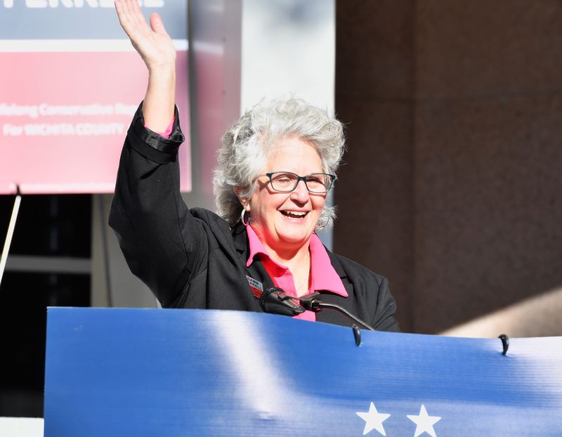 Dawn Ferrell, a veteran of the U.S. Air Force, waves to her supporters during an announcement of her candidacy for Wichita County judge on Jan. 8 on the front steps of the Wichita County Courthouse in Wichita Falls.