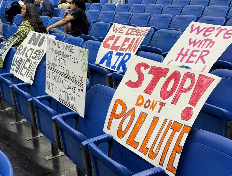 Protest signs fill empty seets at a Jan. 9 meeting on Marathon Petroleum's El Paso refinery air-permit renewal application.