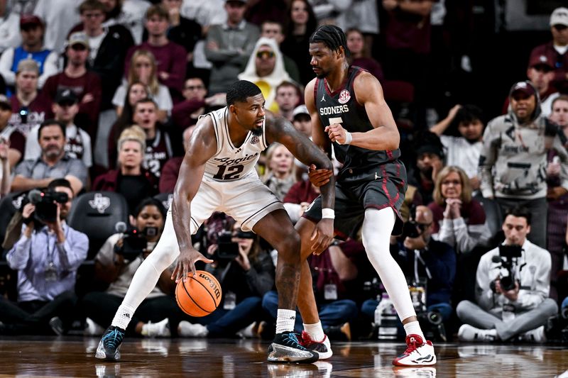 Jan 10, 2026; College Station, Texas, USA; Texas A&M Aggies forward Rashaun Agee (12) controls the ball as Oklahoma Sooners forward Mohamed Wague (5) defends during the second half at Reed Arena. Mandatory Credit: Maria Lysaker-Imagn Images