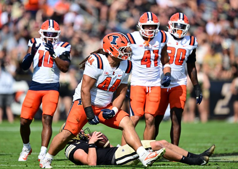 Oct 4, 2025; West Lafayette, Indiana, USA; Illinois Fighting Illini defensive lineman Angelo McCullom (44) celebrates sacking Purdue Boilermakers quarterback Ryan Browne (15) during the second quarter at Ross-Ade Stadium. Mandatory Credit: Marc Lebryk-Imagn Images