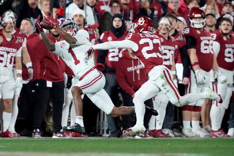Alabama Crimson Tide wide receiver Isaiah Horton (1) catches a pass in front of Oklahoma Sooners defensive back Eli Bowen (23) during a first-round College Football Playoff game between the University of Oklahoma Sooners (OU) and the Alabama Crimson Tide at Gaylord Family â€“ Oklahoma Memorial Stadium in Norman, Okla., Friday, Dec. 19, 2025. Alabama won 34-24.