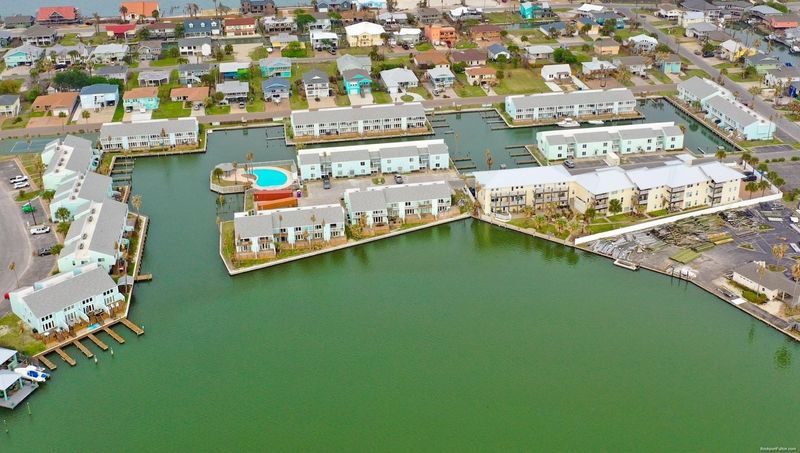 An aerial photo of the Key Allegro Condominiums in Rockport. The condominiums are the blue buildings shown in the picture.