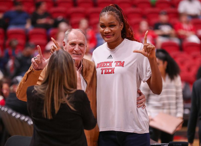 Texas Tech's Stephanie Okechukwu takes a photo with a fan prior to a Big 12 Conference women's basketball game, Tuesday, Jan. 13, 2026, in United Supermarkets Arena.