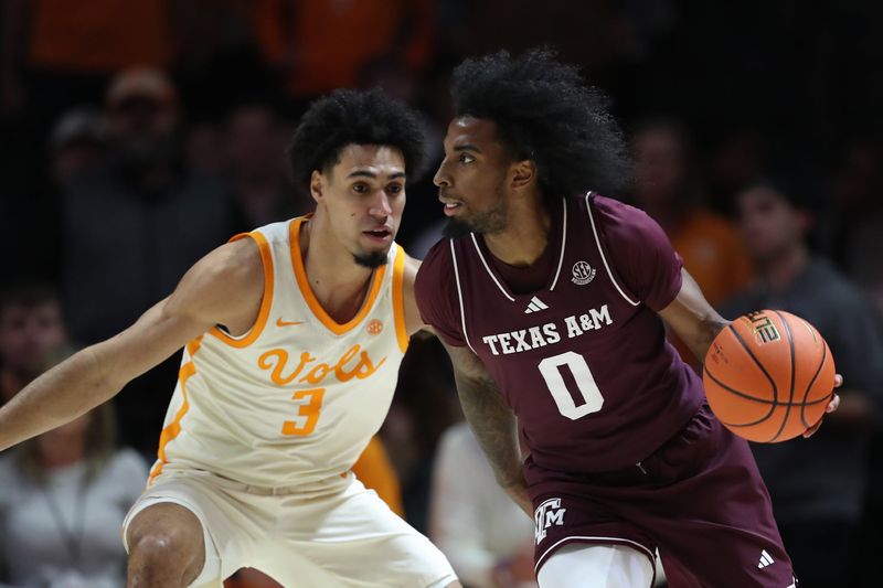 Jan 13, 2026; Knoxville, Tennessee, USA; Texas A&M Aggies guard Marcus Hill (0) dribbles against Tennessee Volunteers guard Bishop Boswell (3) during the first half at Thompson-Boling Arena at Food City Center. Mandatory Credit: Randy Sartin-Imagn Images