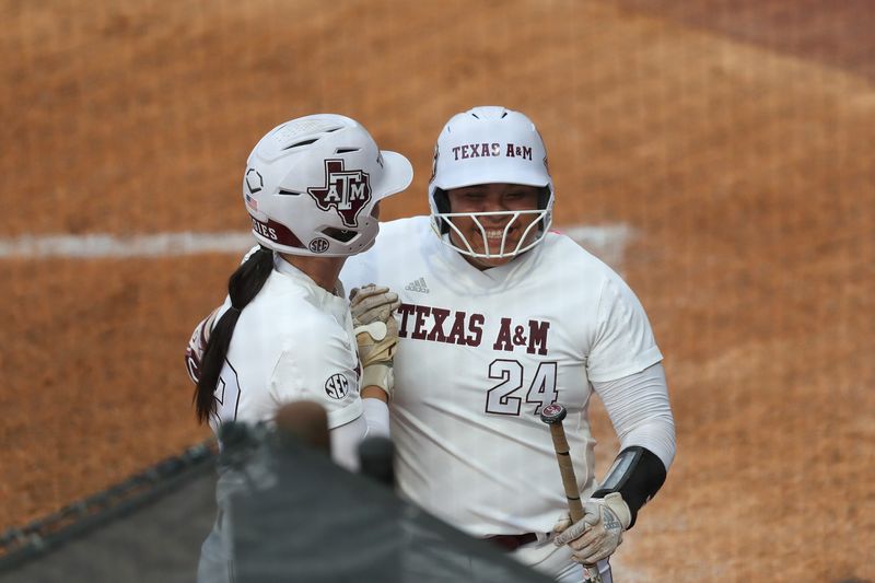 May 9, 2025; Athens, GA, USA; Texas A&M infielder Mya Perez (24) reacts to her run with Texas A&M infielder Koko Wooley (3) during a game against Texas at Jack Turner Stadium. Mandatory Credit: Mady Mertens-Imagn Images