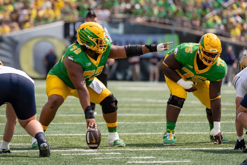 Oregon offensive linemen Iapani Laloulu, left, and Emmanuel Pregnon line up as the Oregon Ducks host the Montana State Bobcats on Aug. 30, 2025, at Autzen Stadium in Eugene, Oregon.