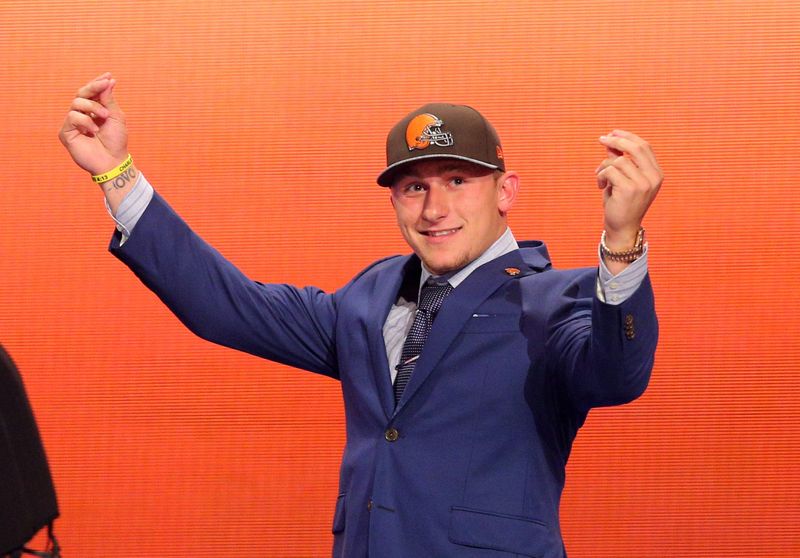 May 8, 2014; New York, NY, USA; Johnny Manziel (Texas A&M) gestures on stage after being selected as the number twenty-two overall pick in the first round of the 2014 NFL Draft to the Cleveland Browns at Radio City Music Hall.