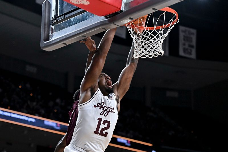 Jan 21, 2026; College Station, Texas, USA; Texas A&M Aggies forward Rashaun Agee (12) dunks the ball against the Mississippi State Bulldogs during the first half at Reed Arena. Mandatory Credit: Maria Lysaker-Imagn Images