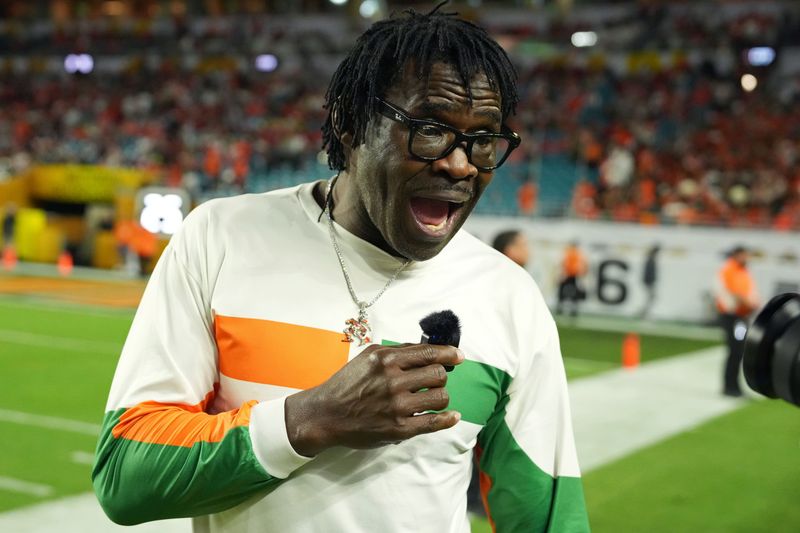 Jan 19, 2026; Miami Gardens, FL, USA; Miami Hurricanes former player Michael Irvin is interviewed on the sideline during halftime of the College Football Playoff National Championship game at Hard Rock Stadium. Mandatory Credit: Kirby Lee-Imagn Images