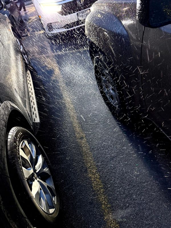Ice crystals blow into an Abilene grocery store parking lot as sleet falls Friday evening. Sleeting continued through the night, mixing with snow as a major winter storm moved through the Big Country.