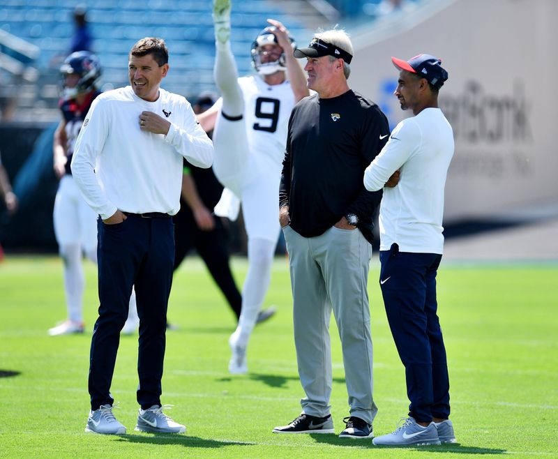 Jacksonville Jaguars head coach Doug Pederson talks with Houston Texans defensive backs coach Dino Vasso and Senior Offensive Assistant Bill Lazor before the start of Sunday's game. The Jacksonville Jaguars hosted the Houston Texans at EverBank Stadium in Jacksonville, Fla. Sunday, September 24, 2023. [Bob Self/Florida Times-Union]