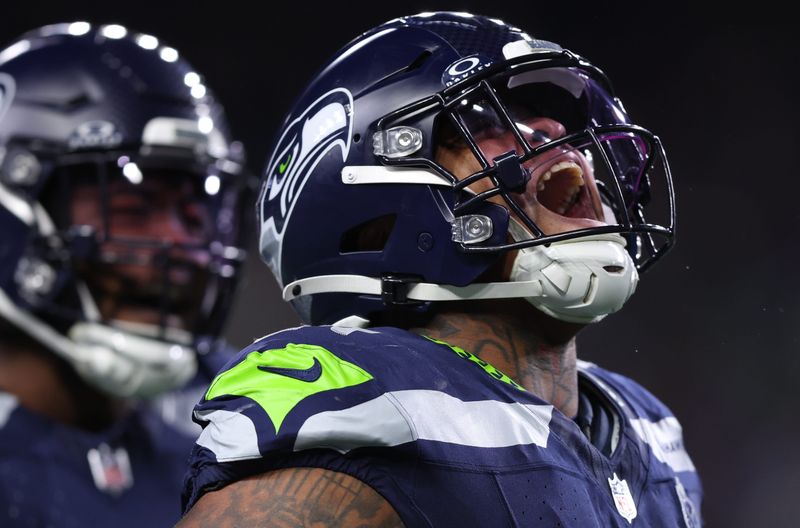 Oct 20, 2025; Seattle, Washington, USA; Seattle Seahawks defensive tackle Byron Murphy II (91) celebrates after a play during the second quarter against the Houston Texans at Lumen Field. Mandatory Credit: Kevin Ng-Imagn Images