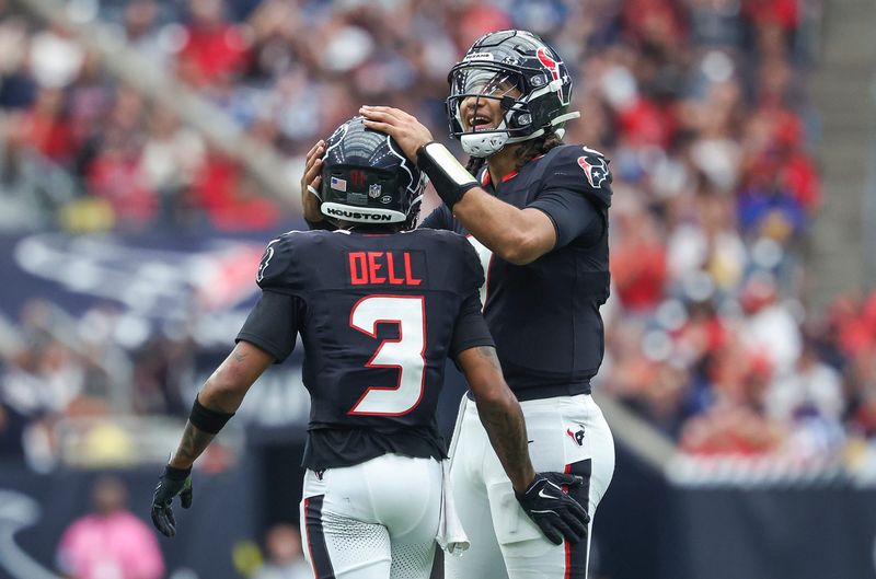 Oct 27, 2024; Houston, Texas, USA; Houston Texans quarterback C.J. Stroud (7) and wide receiver Tank Dell (3) react after a play during the fourth quarter against the Indianapolis Colts at NRG Stadium. Mandatory Credit: Troy Taormina-Imagn Images