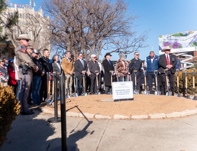 Elected officials, first responders and community leaders stand with ceremonial shovels during a groundbreaking ceremony Thursday, Jan. 29, 2026, for the Texas Panhandle First Responders Memorial near 11th Avenue and South Polk Street in downtown Amarillo.