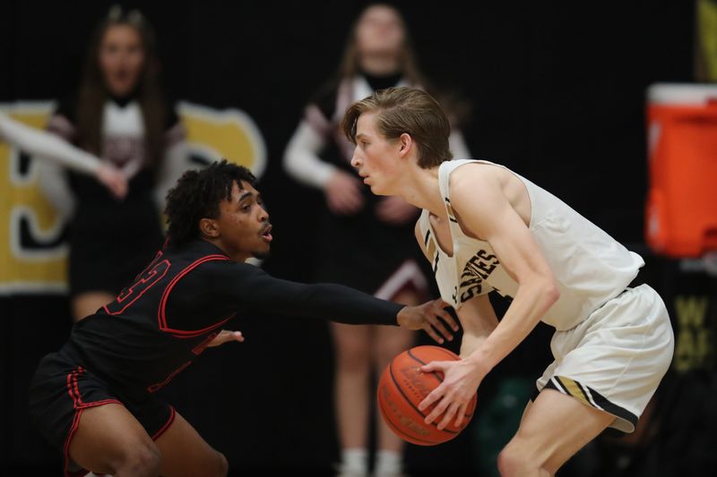 Tascosa High School's Kayvion Blackshere (13) tries to steal the ball from Amarillo High School's Clay Cameron (5) during a District 3-5A matchup Friday, Jan. 30, 2026 at Amarillo High School.