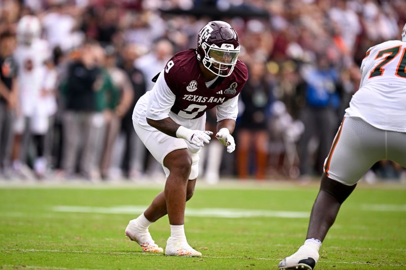 Dec 20, 2025; College Station, TX, USA; Texas A&M Aggies defensive end Cashius Howell (9) lines up during the game between the Aggies and the Hurricanes at Kyle Field. Mandatory Credit: Jerome Miron-Imagn Images