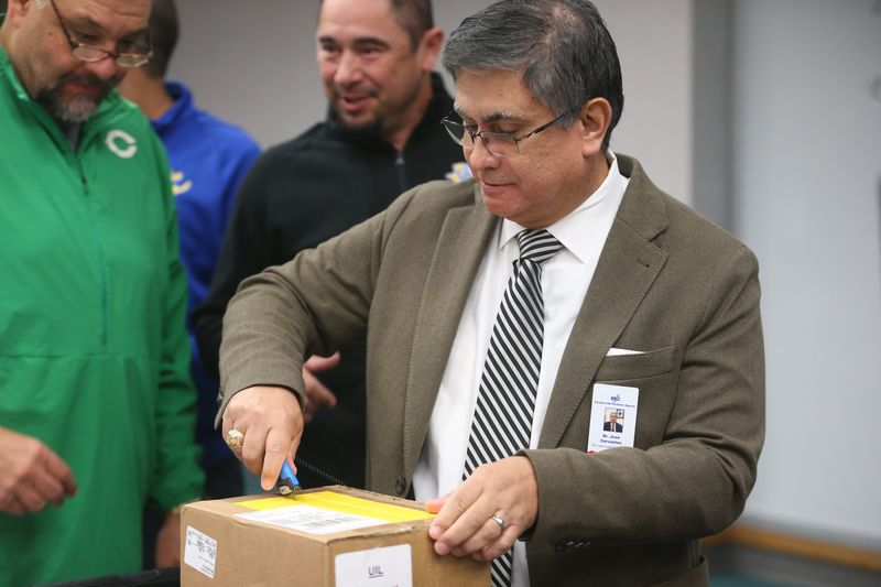 Jose Cervantes opens the University Interscholastic League box with the alignments for the 2026-28 cycle at Education Service Center, Region 2 in Corpus Christi, Texas on Monday, Feb. 2, 2026.