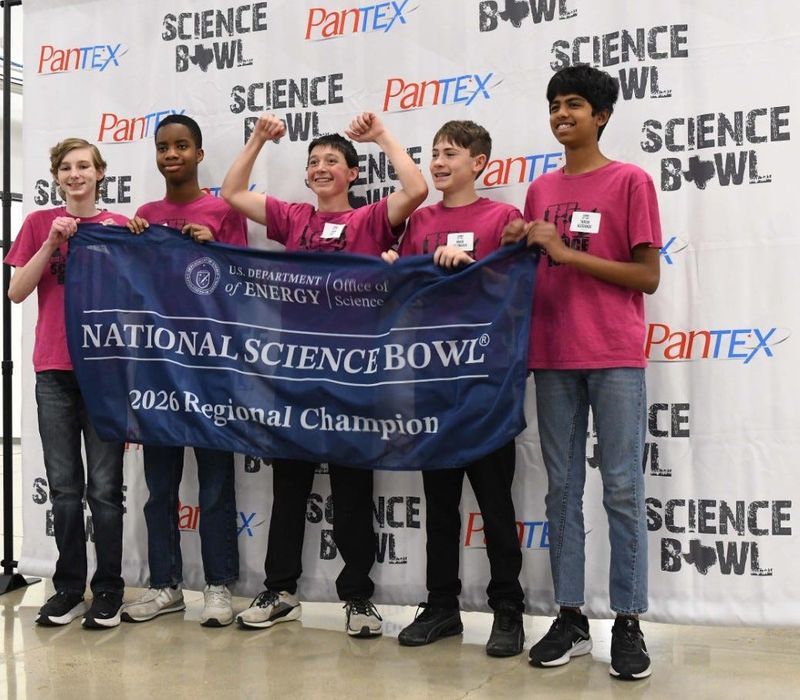 Members of Bonham Middle School’s Science Bowl Team 1 pose with the National Science Bowl banner after winning the Pantex Regional Middle School Science Bowl on Jan. 31 at Amarillo’s AmTech Career Academy.