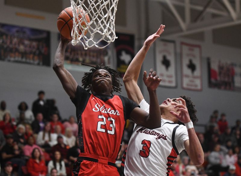 Slaton's Z'qedrian Whaley attempts a dunk against Shallowater in a District 2-3A boys basketball game Tuesday, Feb. 3, 2026, at Shallowater High School in Shallowater.
