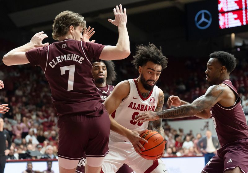 Feb 4, 2026; Tuscaloosa, AL, USA; Alabama guard Houston Mallette (95) tries to get up a shot in the middle of the Texas A&M defense in the lane at Coleman Coliseum. Mandatory Credit: Gary Cosby Jr.-Tuscaloosa News