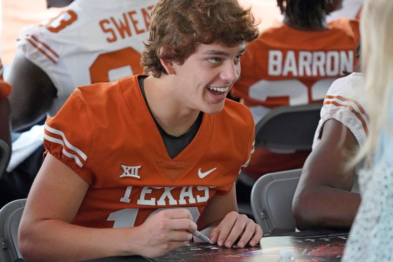 Apr 15, 2023; Austin, TX, USA; Texas Longhorns quarterback Arch Manning (16) signs autographs for fans before the Texas Spring Game at DKR- Texas Memorial Stadium. Mandatory Credit: Scott Wachter-USA TODAY Sports