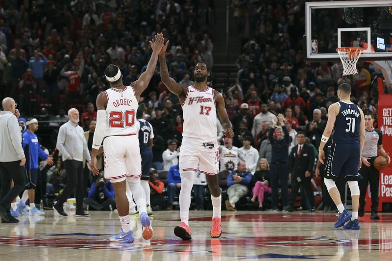 Jan 31, 2026; Houston, Texas, USA; Houston Rockets forward Tari Eason (17) celebrates with guard Josh Okogie (20) after a play during the fourth quarter against the Dallas Mavericks at Toyota Center. Mandatory Credit: Troy Taormina-Imagn Images