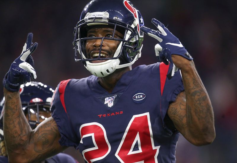 Dec 1, 2019; Houston, TX, USA; Houston Texans cornerback Johnathan Joseph (24) celebrates a defensive play against the New England Patriots in the second half at NRG Stadium. Mandatory Credit: Thomas B. Shea-USA TODAY Sports