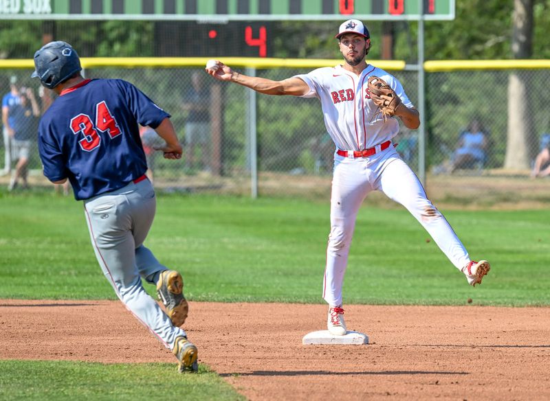 Chris Hacopian of Y-D turns a double play as Braden Holcomb of Bourne pulls off. Cape League final
Aug. 12 2025