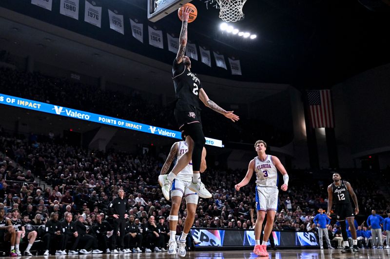 Feb 7, 2026; College Station, Texas, USA; Texas A&M Aggies guard Pop Isaacs (2) goes to the basket during the second half against the Florida Gators at Reed Arena. Mandatory Credit: Maria Lysaker-Imagn Images