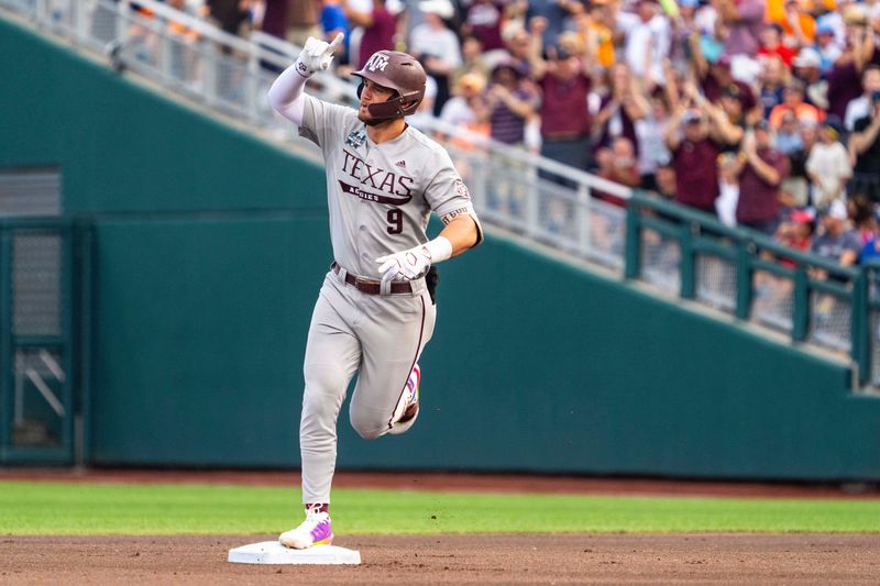 Jun 22, 2024; Omaha, NE, USA; Texas A&M Aggies third baseman Gavin Grahovac (9) celebrates after hitting a home run against the Tennessee Volunteers during the first inning at Charles Schwab Field Omaha. Mandatory Credit: Dylan Widger-USA TODAY Sports