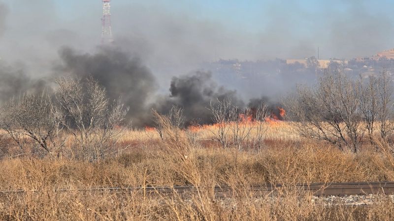A grass fire burns Feb. 9 in Amarillo, as seen off Front Boulevard and Northwest Second. Crews were called out to the fire a little before 1 p.m. and were still working on containing it as of 4:45 p.m.