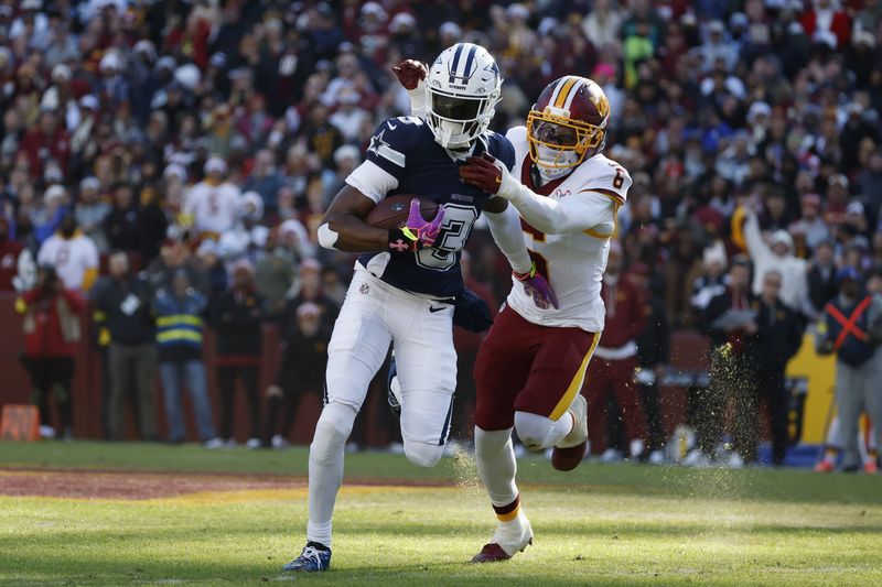 Dec 25, 2025; Landover, Maryland, USA; Dallas Cowboys wide receiver George Pickens (3) carries the ball as Washington Commanders cornerback Noah Igbinoghene (6) defends during the first half at Northwest Stadium. Mandatory Credit: Amber Searls-Imagn Images