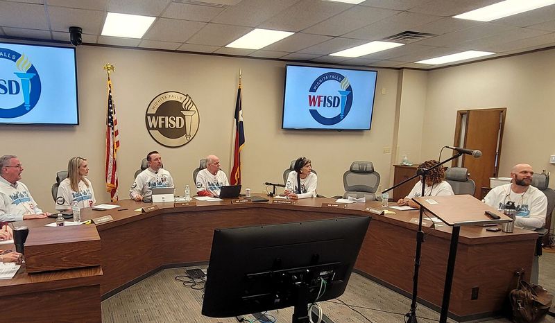 The Wichita Falls ISD School Board members chat before Tuesday night's meeting, wearing matching jerseys from the recent Future Ready Superintendent Leadership Conference held at MSU Texas.