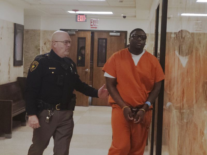 Tony Thomas is escorted Tuesday out of the 137th District Court where he was sentenced to 30 years in oprison after pleading guilty to murder in the April 2024 shooting of Jose Gonzalez at the Executive Inn.