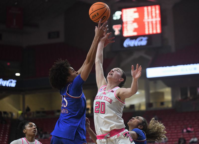 Texas Tech's Bailey Maupin (20) goes after a rebound against Kansas' Jaliya Davis in a Big 12 women's basketball game Tuesday, Feb. 10, 2026, at United Supermarkets Arena.