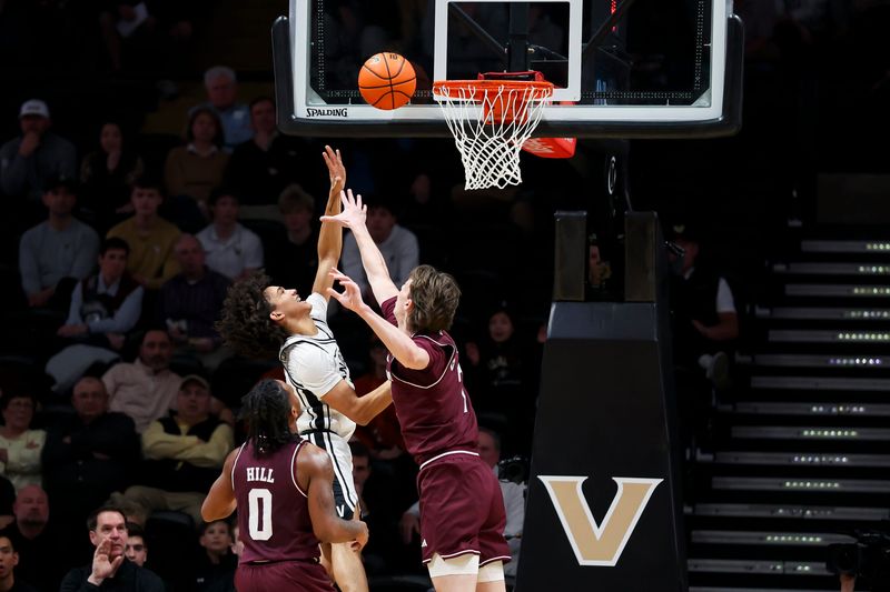 Feb 14, 2026; Nashville, Tennessee, USA; Vanderbilt Commodores guard Tyler Tanner (3) shoots over Texas A&M Aggies forward Zach Clemence (7) during the first half at Memorial Gymnasium. Mandatory Credit: Steve Roberts-Imagn Images