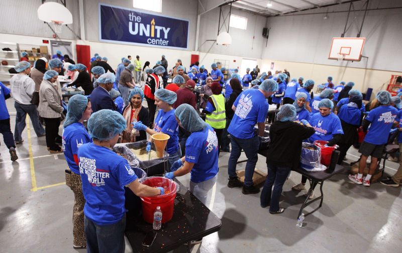 Around 50 volunteers spent Saturday afternoon in Lubbock's new Unity Center packaging rice and grain to make approximately 30,000 individual meals to feed the hungry in and around Lubbock.